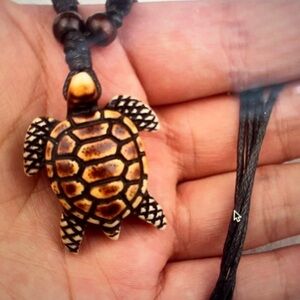 Ethnic style brown turtle wax rope unisex necklace.